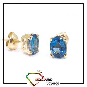 TOPOS ORO AMARILLO 18 K CON TOPACIO NATURAL LONDON BLUE - hover