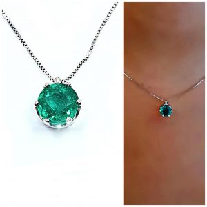 Cadena y dije oro blanco 18 k con esmeralda talla redonda 0,9 ct peso total aprox - hover